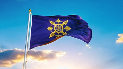 Kosovo flag flying high against a blue sky Video