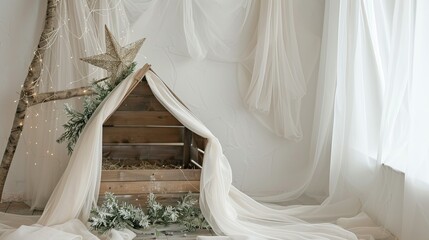 White tulle fabric with a wooden manger and a star 