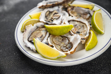 Oysters fresh seafood tasty food dish Fresh delicious gourmet food background on the table rustic food top view copy space top view pescetarianism diet