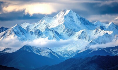 Fototapeta premium The mountains are covered in snow and the sky is cloudy