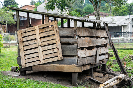 Rustic rural building in old wood for raising pigs and chickens