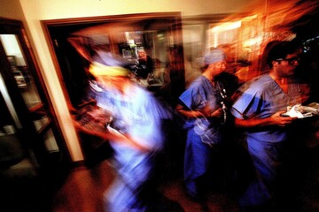 Fototapeta premium Motion blur in hospital: surgeons in intense emergency scene