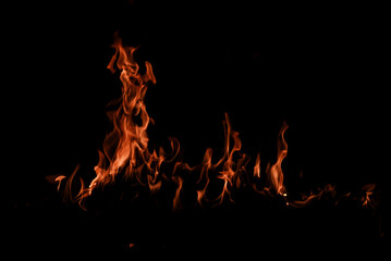 Texture of fire on black background. Hell bonfire. Texture of fire on a black background. Fire over...