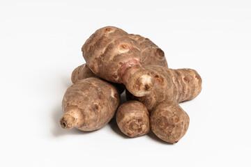 Pile of Fresh Jerusalem Artichokes Roots on White Background