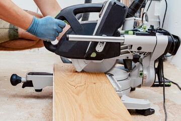 Cutting Wooden Plank with Circular Saw for Flooring