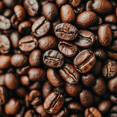 Fototapeta premium Close-up of a rich array of roasted coffee beans, showcasing their deep brown hues and glossy texture.