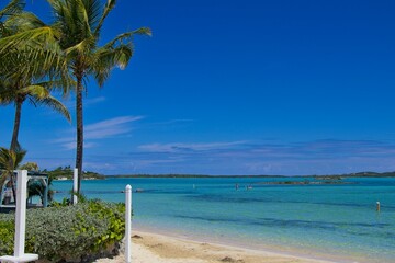 Splashing in crystal clear waters off the coast of Exuma, Bahamas