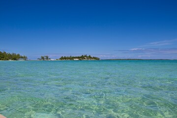 Splashing in crystal clear waters off the coast of Exuma, Bahamas