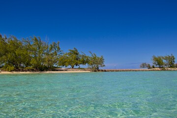 Splashing in crystal clear waters off the coast of Exuma, Bahamas