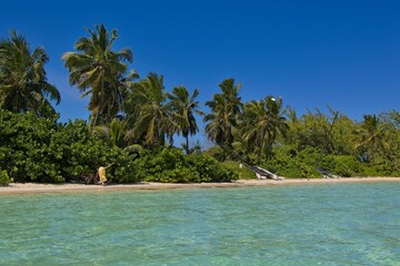 Splashing in crystal clear waters off the coast of Exuma, Bahamas