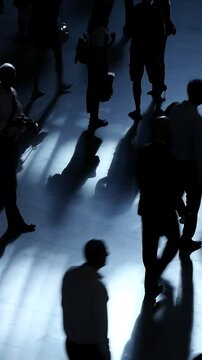 Silhouettes of Diverse Groups of People Walking in a Vibrant Modern Urban Environment