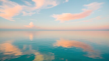 Obraz premium Peaceful Ocean Horizon with Soft Pastel Clouds Reflecting on Calm Water in a Tranquil Scene