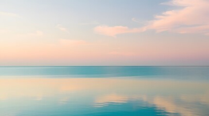 Fototapeta premium Peaceful Ocean Horizon with Soft Pastel Clouds Reflecting on Calm Water in a Tranquil Scene