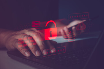 Cybersecurity, Hacker attack. Security breach, system hacked, internet cyber attack alert with red broken padlock. Professional hacker with laptop and smartphone. Online business security technology.