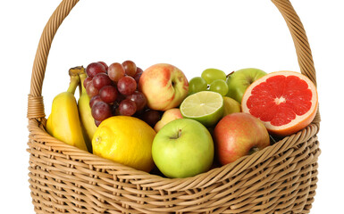 Many different fresh fruits in wicker basket isolated on white