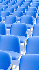 Fototapeta premium rows blue chairs a minimalist design