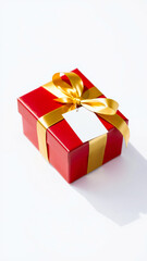 Obraz premium red gift box with golden ribbon white tag