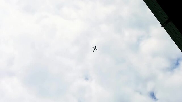 aircraft ATR type airplanes fly under the clouds
