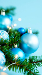 Fototapeta premium blue christmas ornaments on a tree branch