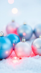 Fototapeta premium shiny ornaments resting on a snowy surface