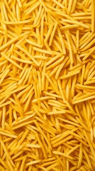 Fototapeta premium A close-up shot of a pile of golden french fries, ready to be cooked.
