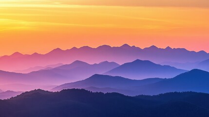 Fototapeta premium Serene mountain landscape at sunset with layered hues.