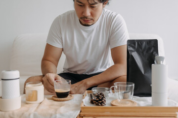 Step by step of Asian man making espresso with hand press tools.