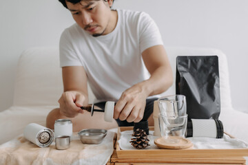 Step by step of Asian man making espresso with hand press tools.