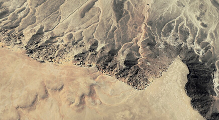 The landscape of the sandy desert in Qatar from a bird's eye view