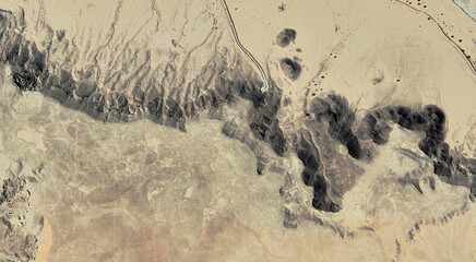The landscape of the sandy desert in Qatar from a bird's eye view