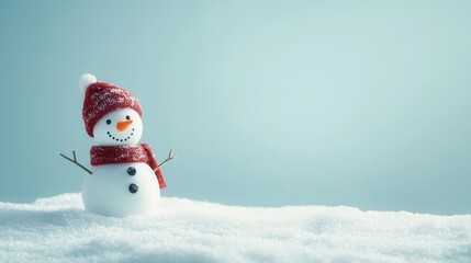 Fototapeta premium Cheerful snowman wearing a red knit santa hat and scarf, with twig arms against a simple light blue background. Ideal for winter-themed designs, and holiday cards. Joy and the Festive Spirit concept