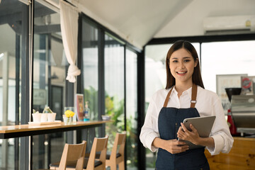 Fototapeta premium Professional coffee shop café SME owner employer or employee is welcome and ready to making coffee for customer. 