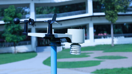 Wireless Weather Station. Close up of black and white wireless weather station on outdoor pole for...