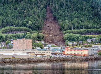 Landslide with mud trail through forest, town and to the sea in Ketchikan Alaska 2024 and service...