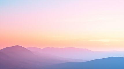 Fototapeta premium A pastel-colored sky at dawn with soft pink, orange, and blue hues just before the sun rises