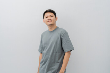 Obraz premium Happy expression of adult Asian man with casual t-shirt isolated on white background