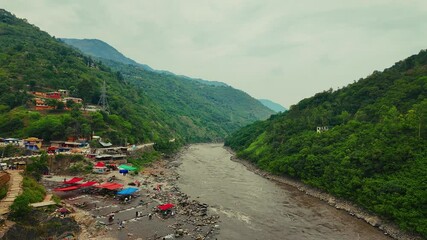 Neelam Point lovers on Jhelum River on a cloudy day in Abbottabad, Khyber Pakhtunkhwa, Pakistan