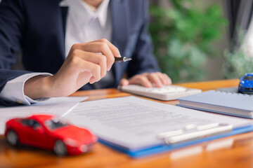 Client decided to buy new car, reviewing auto loan agreements, insurance contract, and other...