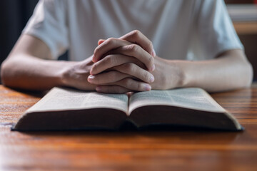 Man clasped his hands in prayer, his faith and belief in Jesus Christ and God guiding his spiritual worship of the holy divine. pray, spiritual, jesus christ, person, hand, faith, worship, belief.