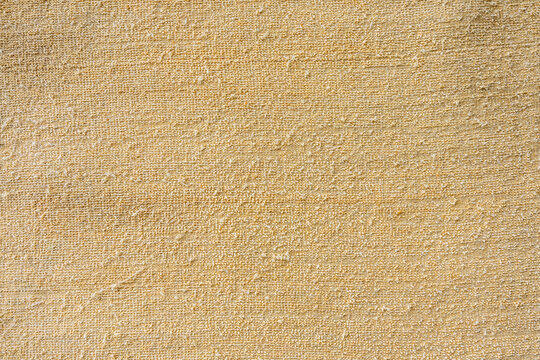 Grainy, sun-kissed sand textures form a natural, earthy backdrop