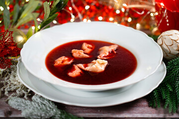 Traditional Polish Christmas beetroot soup with dumplings
