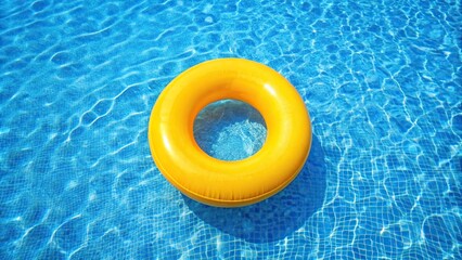 Bright yellow inflatable ring floating in a blue pool