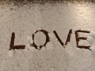 Word LOVE snow writing