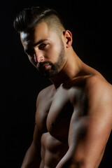 Fototapeta premium Topless man with muscle. Sexy male body. Handsome sexy model. Shirtless muscled male model. Man with a naked torso. Muscular young man with perfect body stripping. Sexy man. Seductive guy.