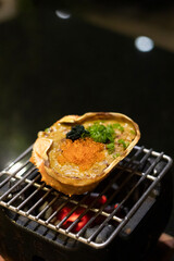 Kanimiso saving with Shiso leaf tempura; Crab 'miso' cooked in the shell with plenty of sake over an open flame.