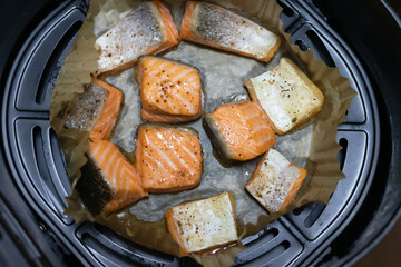 Air fryer lemon pepper salmon in parchment paper. Tasty cooked salmon steak, healthy and easy meals.