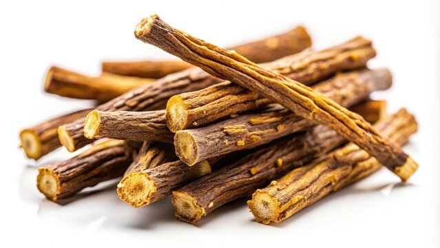 Extreme close-up of ayurvedic herb liquorice root, also known as licorice root, mulethi, or glycyrrhiza glabra root on white background