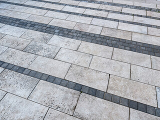 pavement texture. rough textured surface of large gray paving slabs. urban sidewalk