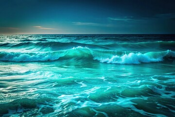 Rolling high sea waves at night with turquoise green water and light blue sky