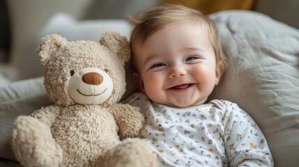 Happy Baby with Toy Bear on Soft Bedding